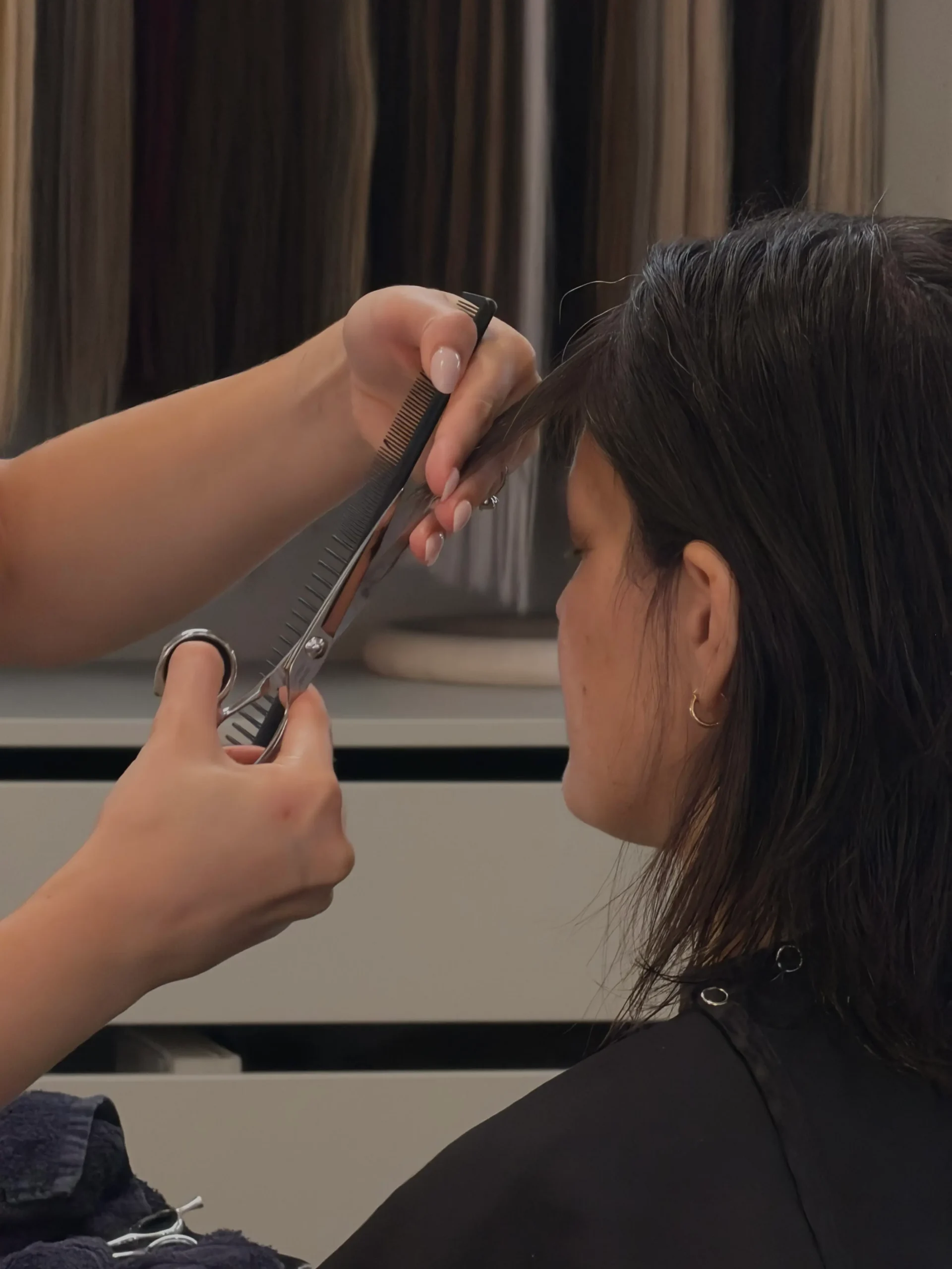 Bang trim in progress at Anna Hair Studio