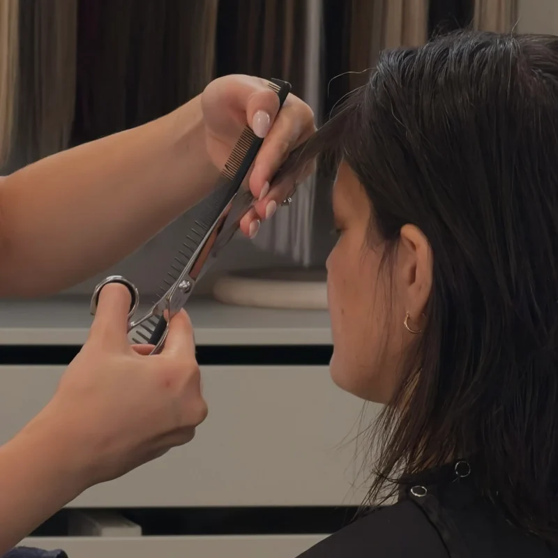 Bang trim in progress at Anna Hair Studio