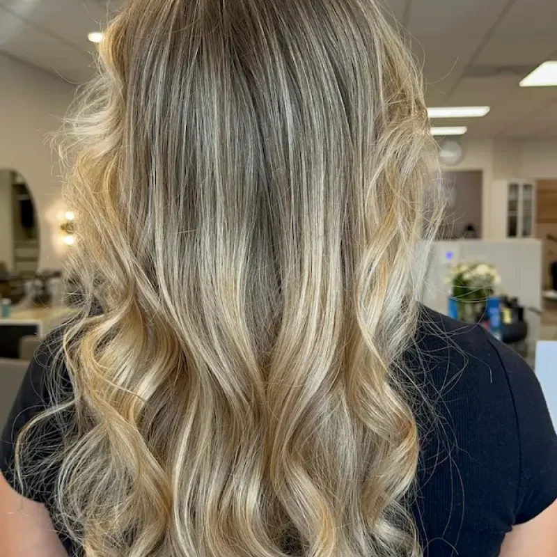 Blonde highlights with soft curls at Anna Hair Studio